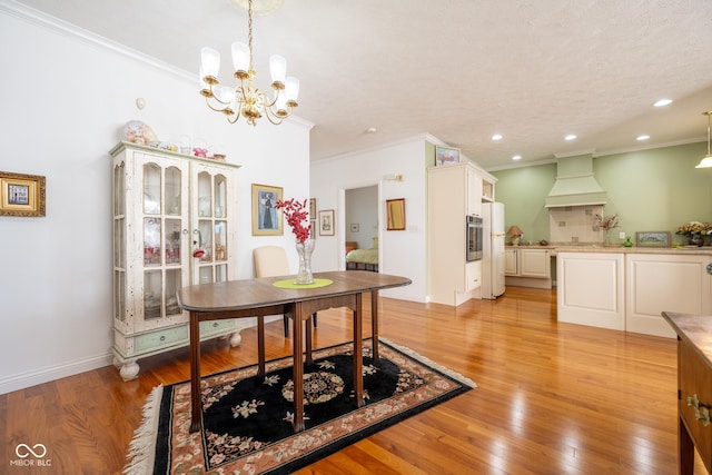 476 Glenview Dr, Greencastle, IN 46135 - dining room with ornamental molding, a chandelier, light wood-style floors, and recessed lighting