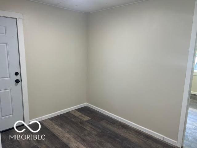 1204 Ladoga Rd, Crawfordsville, IN 47933 - spare room featuring dark wood finished floors and baseboards