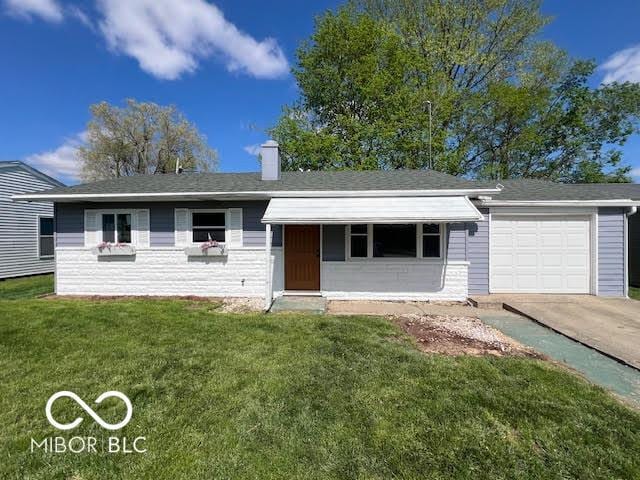 1204 Ladoga Rd, Crawfordsville, IN 47933 - ranch-style home featuring concrete driveway, a front yard, an attached garage, and a chimney