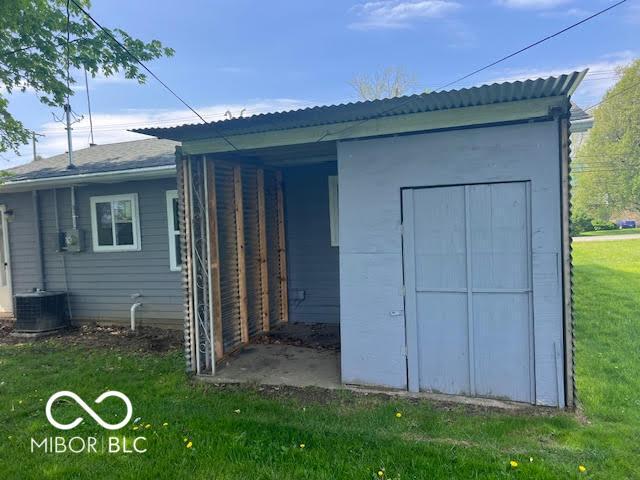 1204 Ladoga Rd, Crawfordsville, IN 47933 - exterior space featuring central AC and a lawn