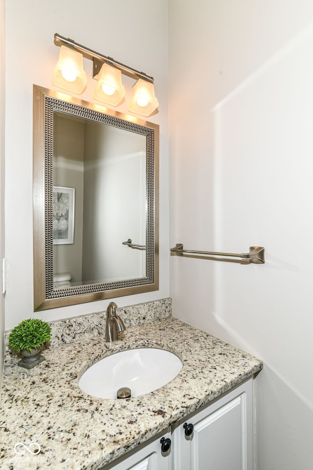 half bath with toilet and vanity
