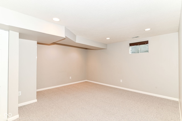 finished basement with carpet floors, recessed lighting, and baseboards