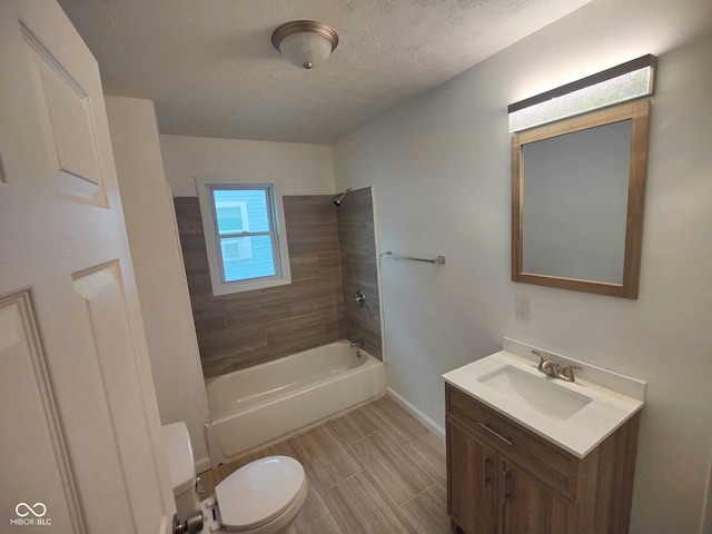 3629 Birchwood Ave, Indianapolis, IN 46205 - full bathroom featuring shower / bathing tub combination, toilet, vanity, baseboards, and a textured ceiling