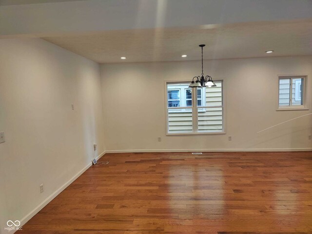 3629 Birchwood Ave, Indianapolis, IN 46205 - unfurnished dining area featuring baseboards, recessed lighting, wood finished floors, and a chandelier