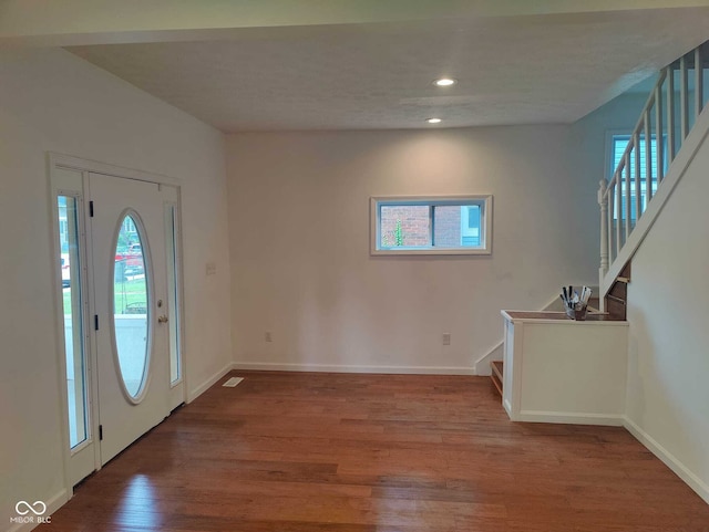 3629 Birchwood Ave, Indianapolis, IN 46205 - entrance foyer with a wealth of natural light, wood finished floors, and stairs
