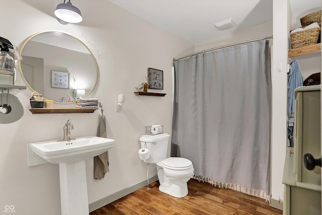 1630 N 400 W, Bargersville, IN 46106 - bathroom featuring a sink, toilet, a shower with shower curtain, wood finished floors, and visible vents