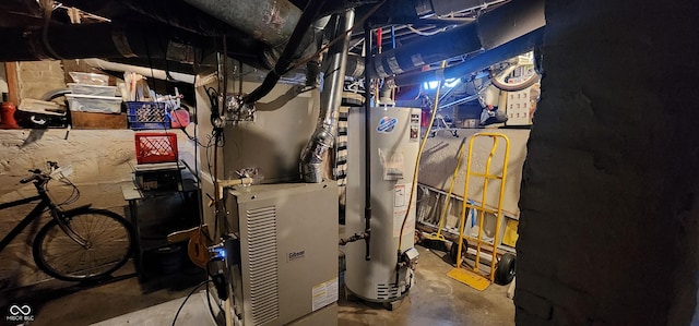 utility room featuring water heater
