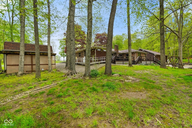 view of yard with a wooden deck