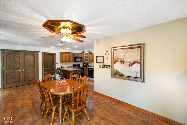 dining area featuring baseboards, dark wood-style floors, recessed lighting, a textured ceiling, and a ceiling fan
