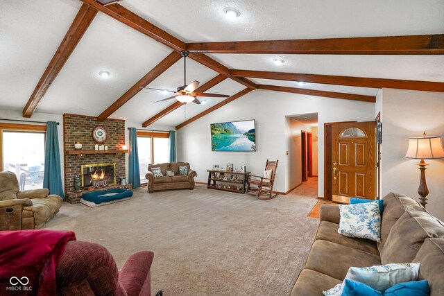 living area featuring lofted ceiling with beams, carpet floors, a brick fireplace, a ceiling fan, and baseboards
