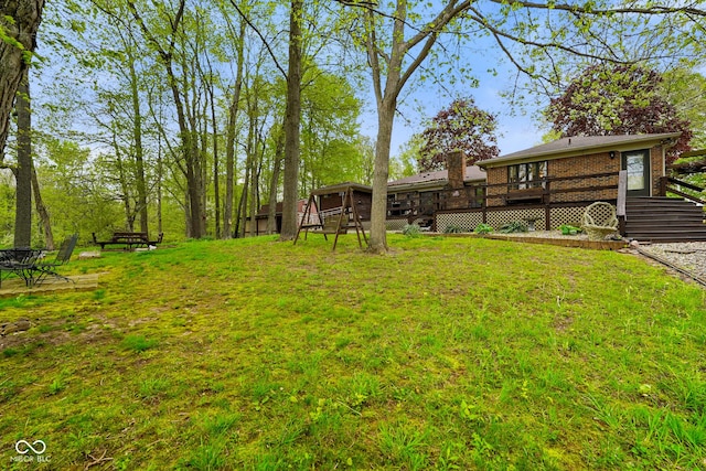 view of yard featuring a deck
