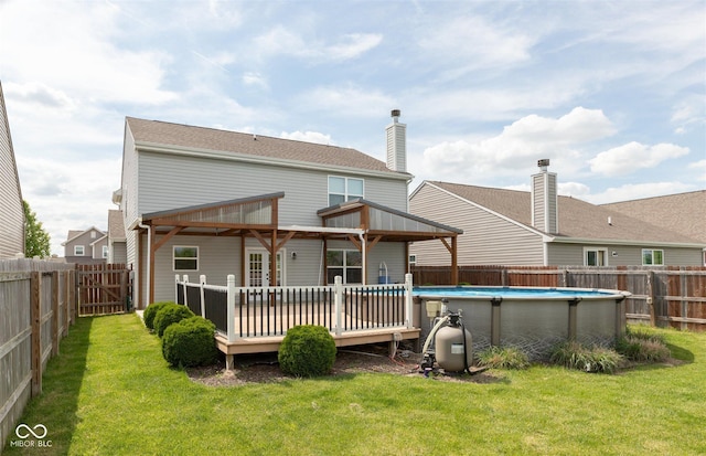 rear view of property featuring a deck