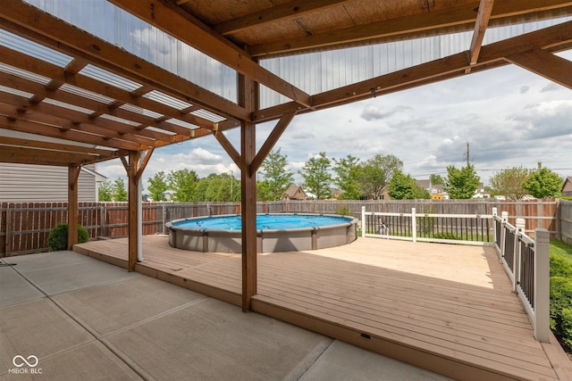 wooden deck featuring a fenced backyard