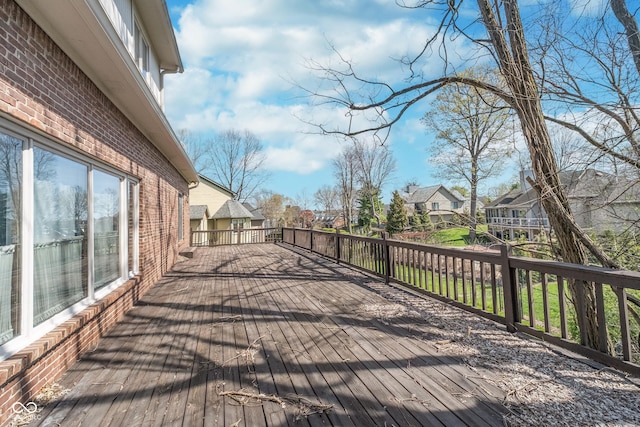 wooden deck featuring a residential view