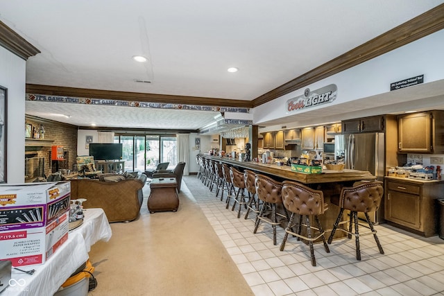interior space with crown molding, recessed lighting, appliances with stainless steel finishes, and visible vents
