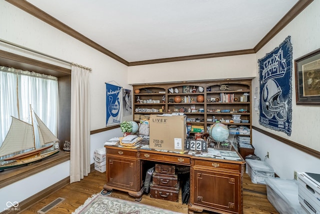 office space with crown molding, dark wood-style flooring, and visible vents