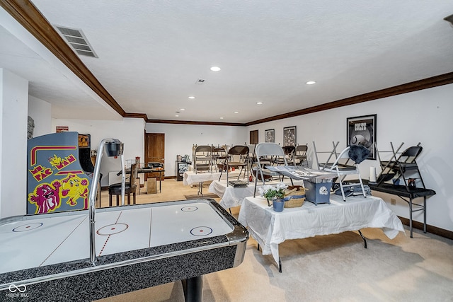 playroom featuring crown molding, baseboards, carpet flooring, and visible vents