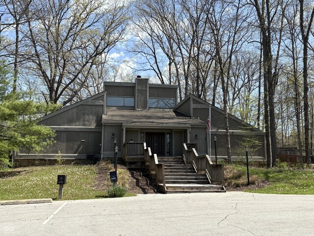 4212 Foxglove Trce, Indianapolis, IN 46237 - mid-century inspired home with a chimney, stairway, and a sunroom