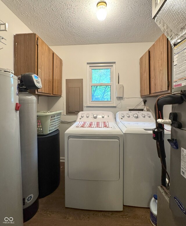 4212 Foxglove Trce, Indianapolis, IN 46237 - laundry room with cabinet space, washing machine and clothes dryer, electric panel, dark wood-style floors, and a textured ceiling
