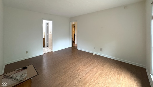 4212 Foxglove Trce, Indianapolis, IN 46237 - spare room with dark wood-style floors and baseboards