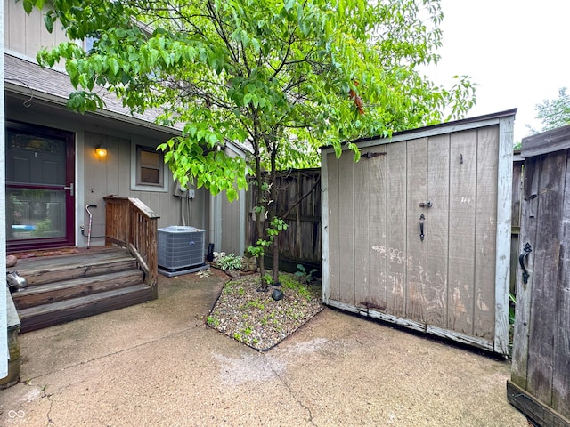 4212 Foxglove Trce, Indianapolis, IN 46237 - fenced backyard with central air condition unit and a patio area