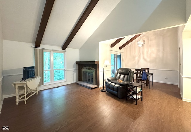 4212 Foxglove Trce, Indianapolis, IN 46237 - living area featuring beamed ceiling, wood finished floors, healthy amount of natural light, a glass covered fireplace, and baseboards