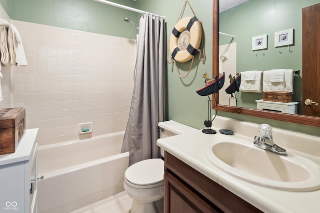 bathroom with toilet, tile patterned floors, shower / bath combo, and vanity