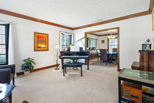 living area with plenty of natural light, a chandelier, light carpet, and visible vents