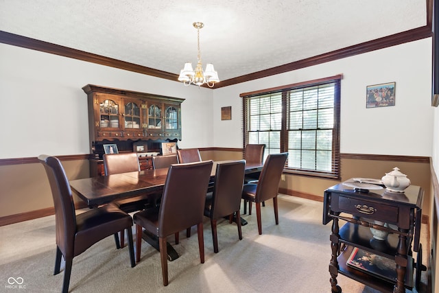 dining area featuring baseboards, a textured ceiling, a chandelier, and light carpet