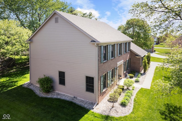 view of property exterior with a lawn