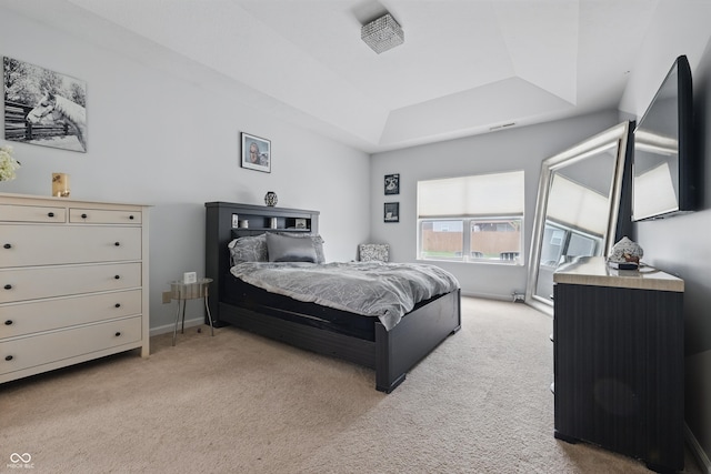 1666 Huntzinger Blvd, Pendleton, IN 46064 - bedroom featuring a tray ceiling, light carpet, and baseboards