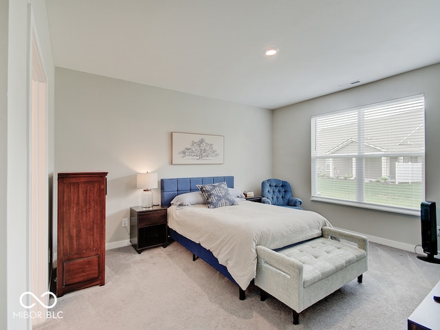 bedroom with light colored carpet, recessed lighting, baseboards, and visible vents