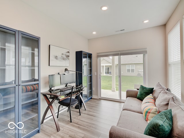 office area featuring visible vents, recessed lighting, and light wood finished floors