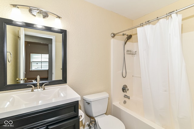 full bathroom with toilet, shower / bathtub combination with curtain, vanity, and a textured wall