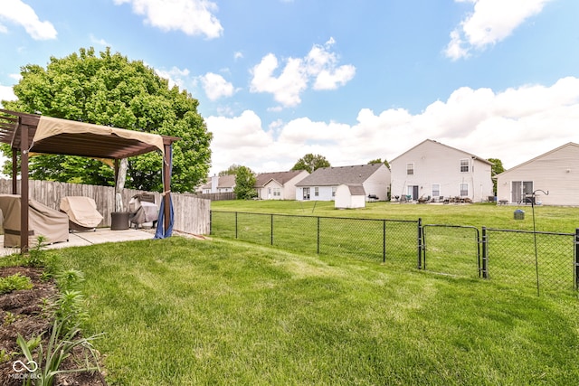 view of yard with a patio area, a residential view, and a pergola