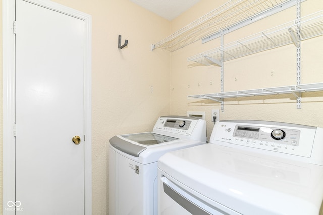 laundry room featuring washer and dryer