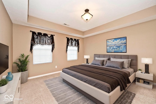 2342 Sheek Rd, Greenwood, IN 46143 - carpeted bedroom with baseboards and a raised ceiling