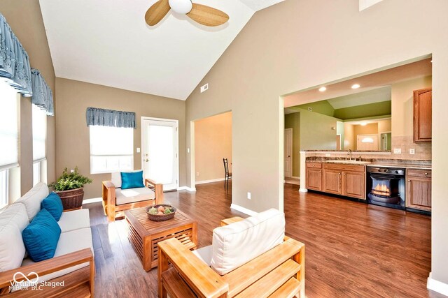 2342 Sheek Rd, Greenwood, IN 46143 - living area featuring high vaulted ceiling, wood finished floors, a ceiling fan, and baseboards