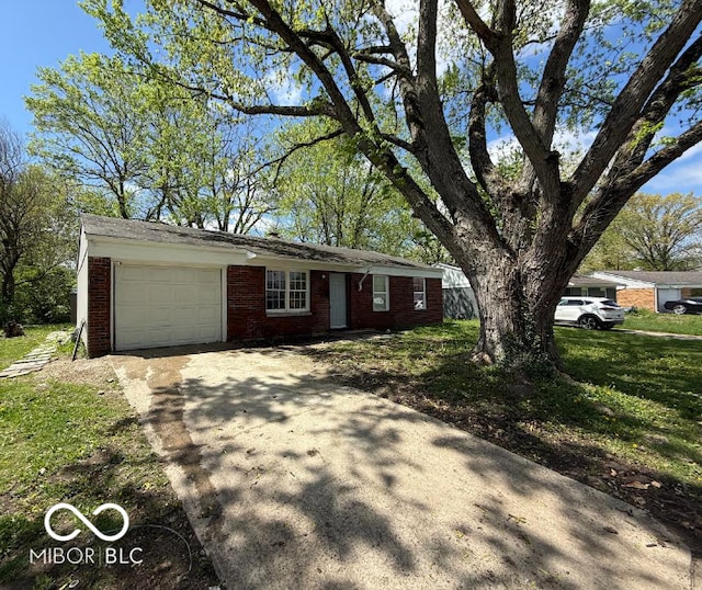 ranch-style home featuring brick siding, an attached garage, and concrete driveway