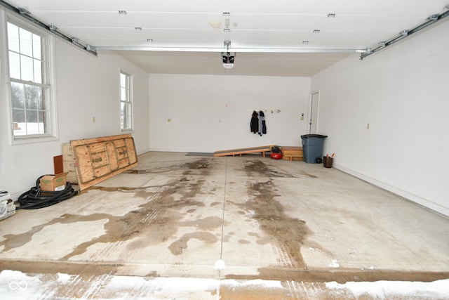 1623 W Stoneybrook Ln, Crawfordsville, IN 47933 - garage with a garage door opener and baseboards