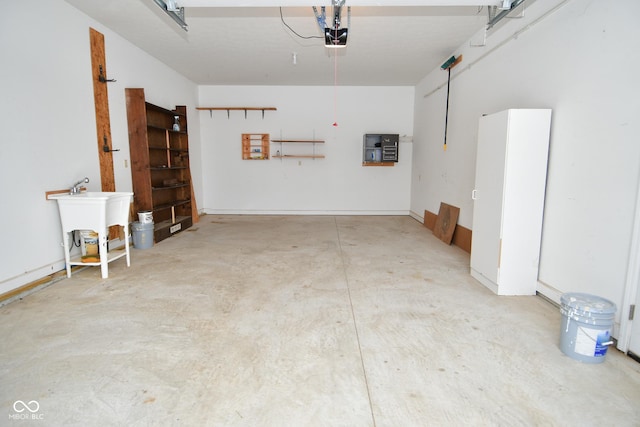1623 W Stoneybrook Ln, Crawfordsville, IN 47933 - garage featuring a sink and a garage door opener