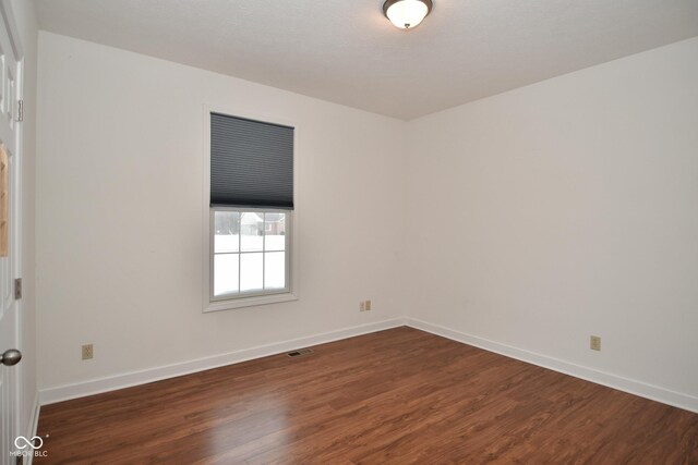 1623 W Stoneybrook Ln, Crawfordsville, IN 47933 - unfurnished room featuring dark wood-style flooring and baseboards