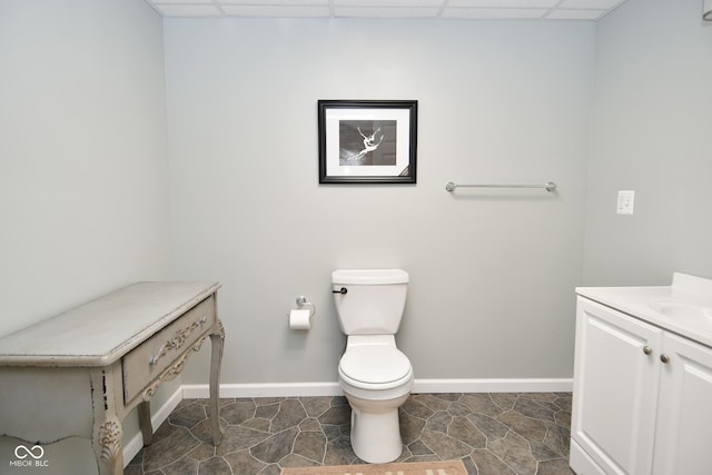 1623 W Stoneybrook Ln, Crawfordsville, IN 47933 - bathroom with vanity, toilet, baseboards, and a drop ceiling