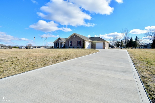1623 W Stoneybrook Ln, Crawfordsville, IN 47933 - ranch-style home featuring concrete driveway, an attached garage, and a front yard
