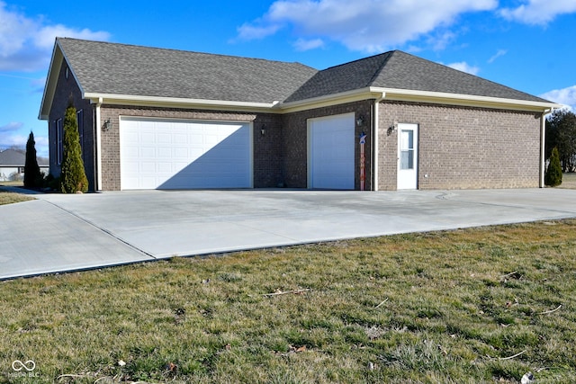 1623 W Stoneybrook Ln, Crawfordsville, IN 47933 - view of front of house with a garage, concrete driveway, a front lawn, and brick siding