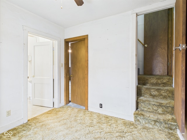 interior space with baseboards and ceiling fan