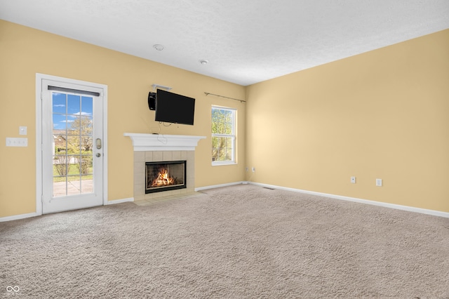 15329 Smithfield Dr, Westfield, IN 46074 - unfurnished living room with carpet floors, baseboards, and a tile fireplace