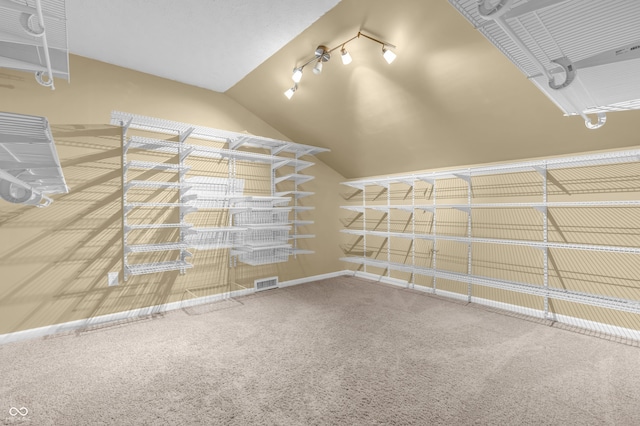 15329 Smithfield Dr, Westfield, IN 46074 - spacious closet featuring visible vents, lofted ceiling, and carpet