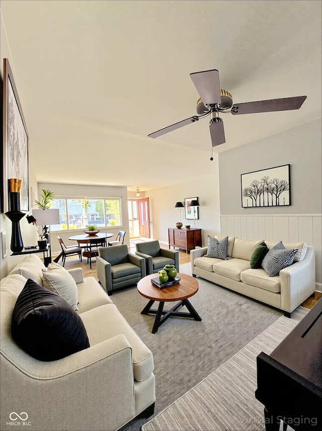 living room featuring ceiling fan and wood finished floors