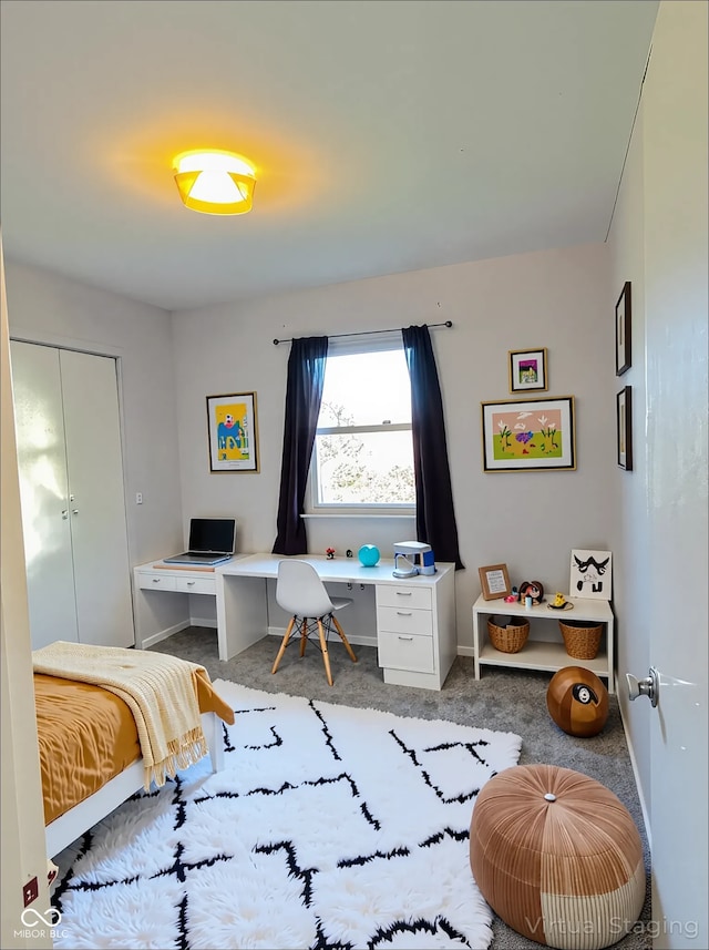 bedroom featuring carpet floors and baseboards